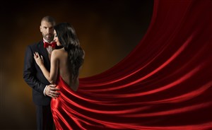 穿西装的男士和穿着红色丝绸长裙的美女高清图片