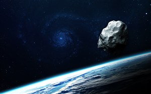 宇宙中的星球表面和漂浮的陨石高清图片