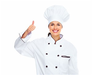 穿着厨师套装伸出大拇指的欧美女性高清图片
