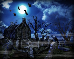 夜晚的墓地和飞翔的蝙蝠高清图片