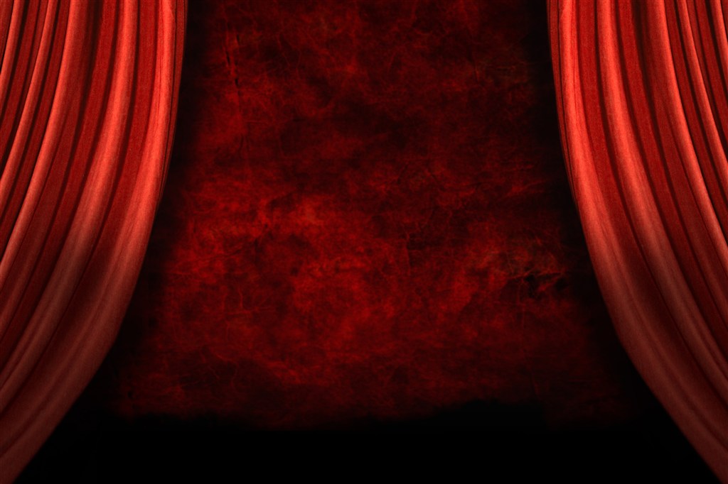 打开的红色窗帘幕布后的红色背景墙高清图片