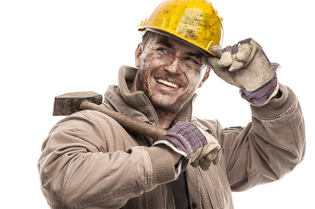 手抬黄色安全帽的矿工高清摄影