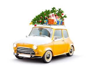 堆满圣诞礼物和积雪的黄色小汽车高清图片