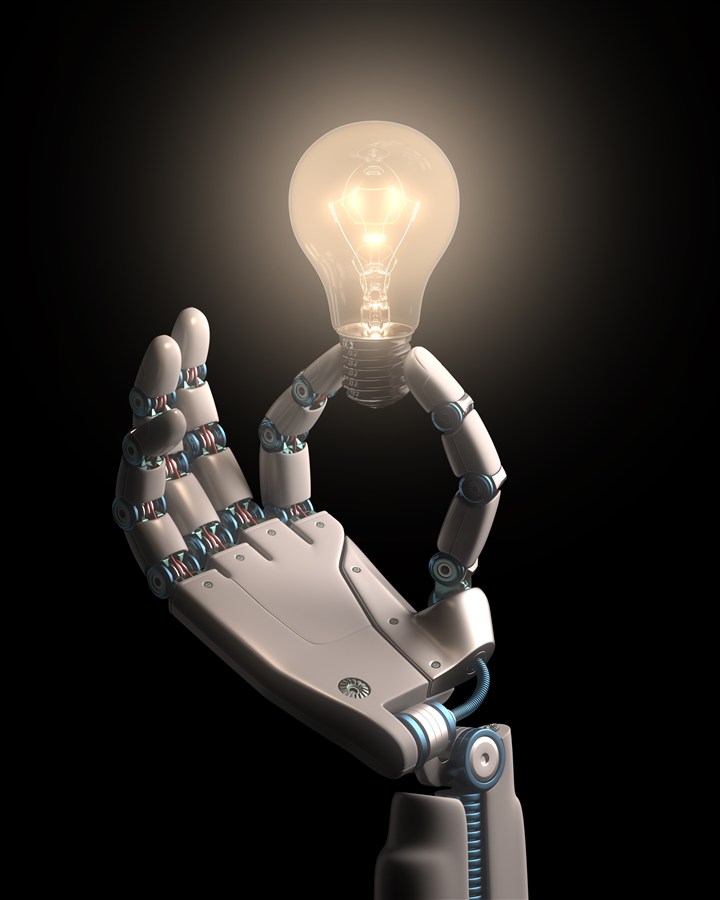 人工智能机器人手中发光的灯泡高清图片